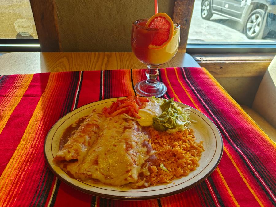 Enchiladas plate with rice and cocktail